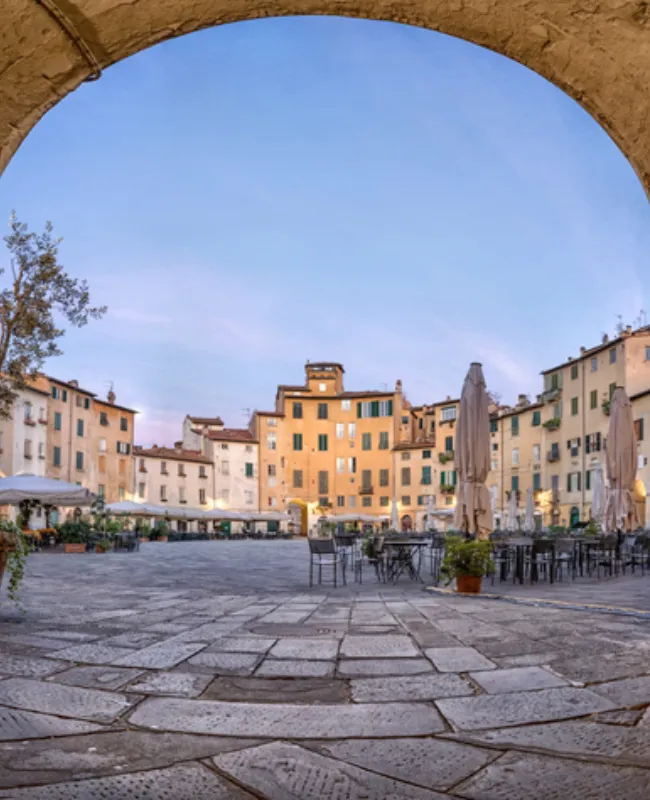 Charming view of the walled city of Lucca, showcasing its medieval architecture and lively historic streets.